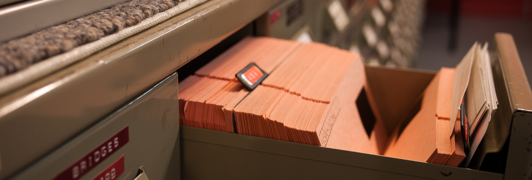 An open drawer holding microfilm records