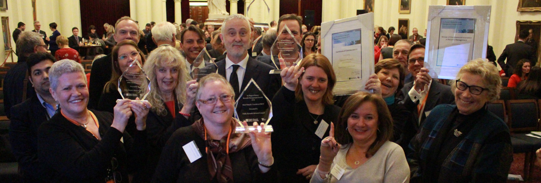 Photo of happy award winners with their trophies