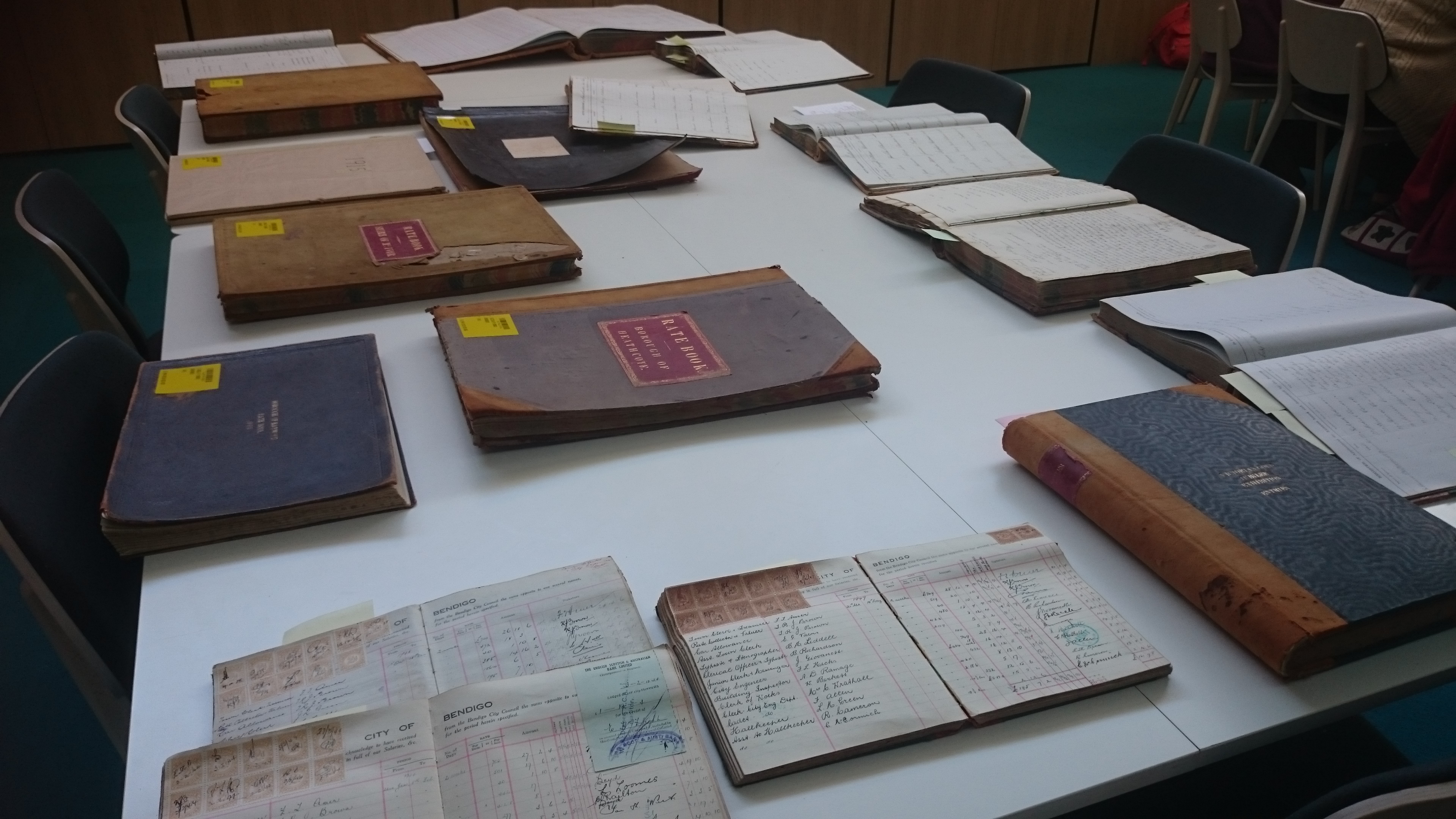 Books and papers laid out on a table