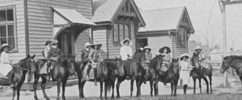 Black and white photo, school children on horses