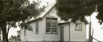 Black and white photo of an old school building